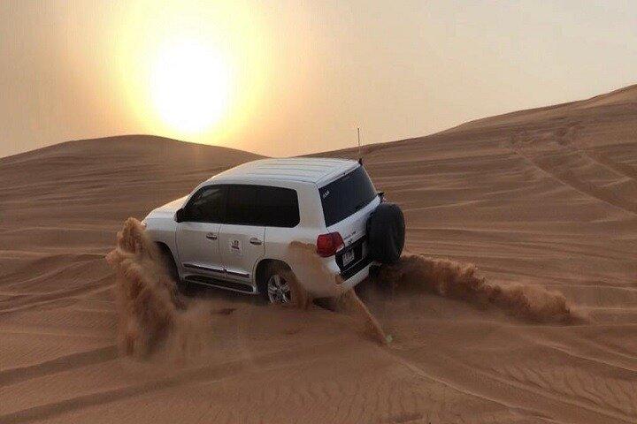 Dubai Desert Safari With Camel Ride and Sand Boarding