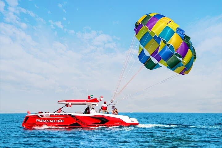 Parasailing in Dubai with Palm Jumeirah and JBR Beach views