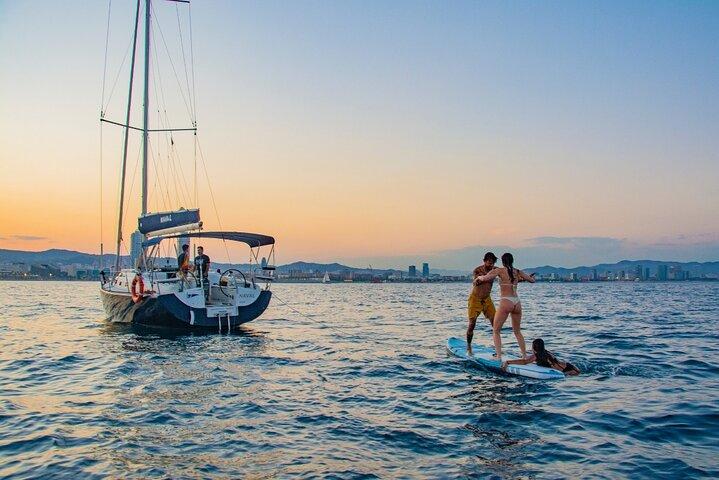 Sunset on a Sailboat along the Coast of Barcelona