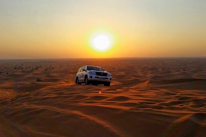 Sunrise Desert Safari with Quad Biking and Camel Riding in Dubai