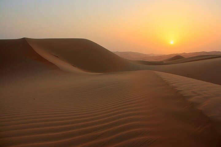 Sunrise Desert Safari with Quad Biking and Camel Riding in Dubai