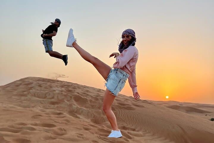 Desert Safari BBQ dinner, Camel ride & sandboarding from Dubai