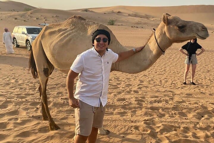 Desert Safari BBQ dinner, Camel ride & sandboarding from Dubai