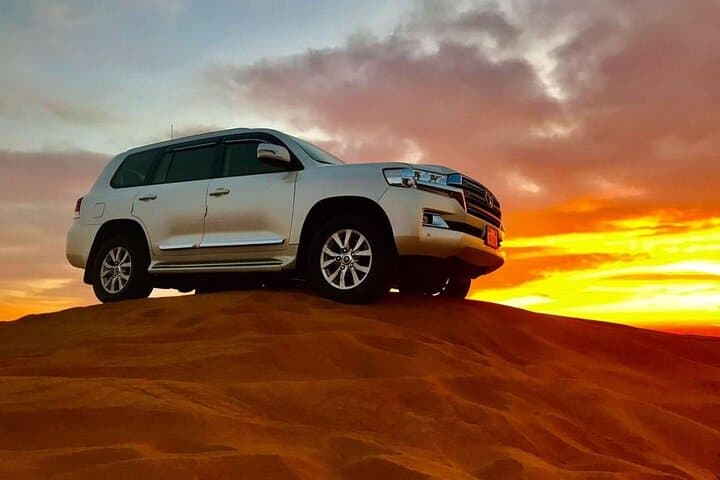 Desert Safari with BBQ Dinner, Camel Ride, Sand Board & Live Show