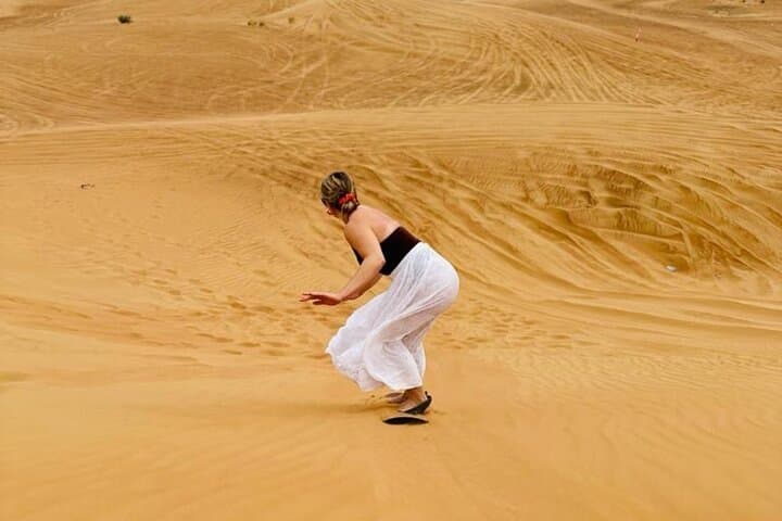 Evening Desert Safari with Camel Ride, BBQ Dinner and Dune Bashing