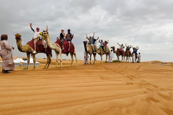 Evening Desert Safari with Camel Ride, BBQ Dinner and Dune Bashing