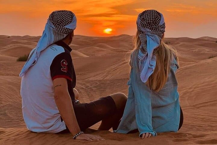 Desert Safari with BBQ Dinner, Camel Ride, Sand Board & Live Show