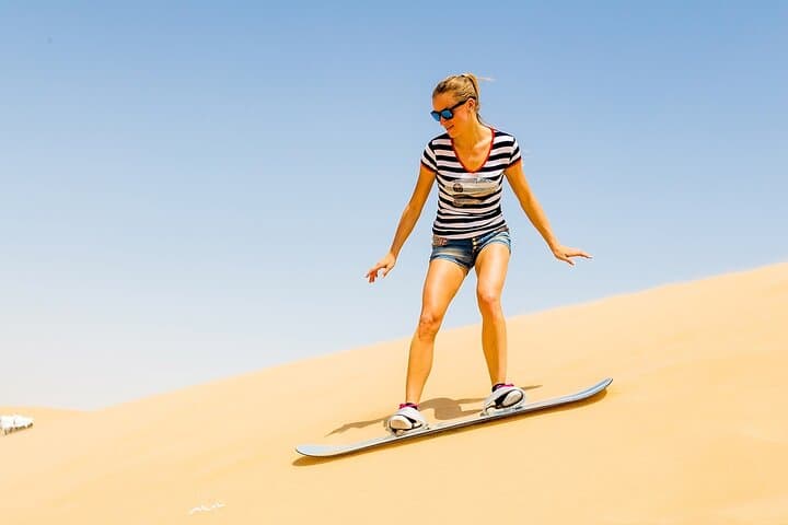 Desert Safari with BBQ Dinner, Camel Ride, Sand Board & Live Show
