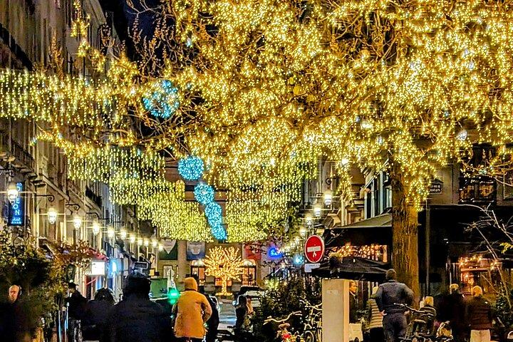 The magical illuminations of Christmas in Paris in an antique car!