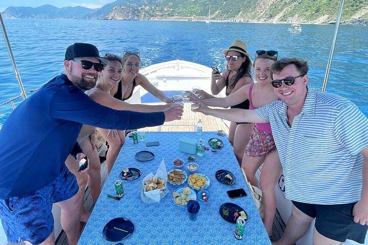 Cinque Terre daytime boat tour with a traditional ligurian gozzo