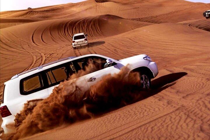 Dubai: Desert Safari, Quad Bike, Camel Ride and Sandboarding