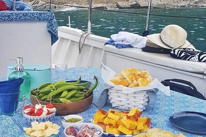 Cinque Terre daytime boat tour with a traditional ligurian gozzo