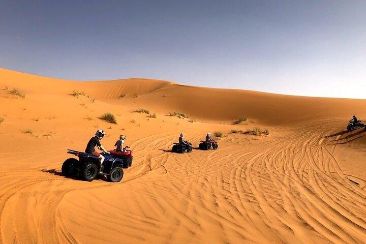 Quad Biking Adventure with Camel and Sand Boarding Tour Abu Dhabi