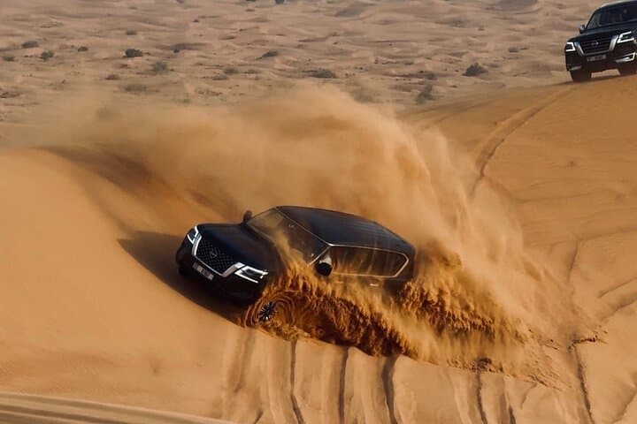 Premium Desert Safari Camel Ride with Sandboarding and BBQ Dinner