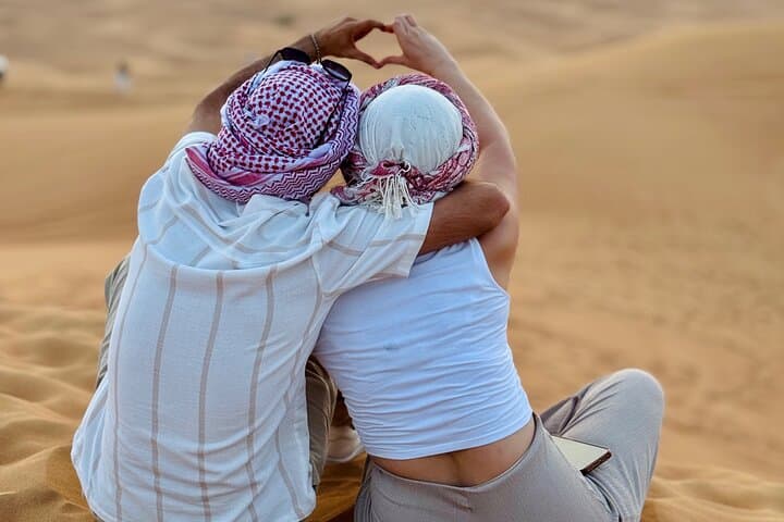 Premium Desert Safari Camel Ride with Sandboarding and BBQ Dinner